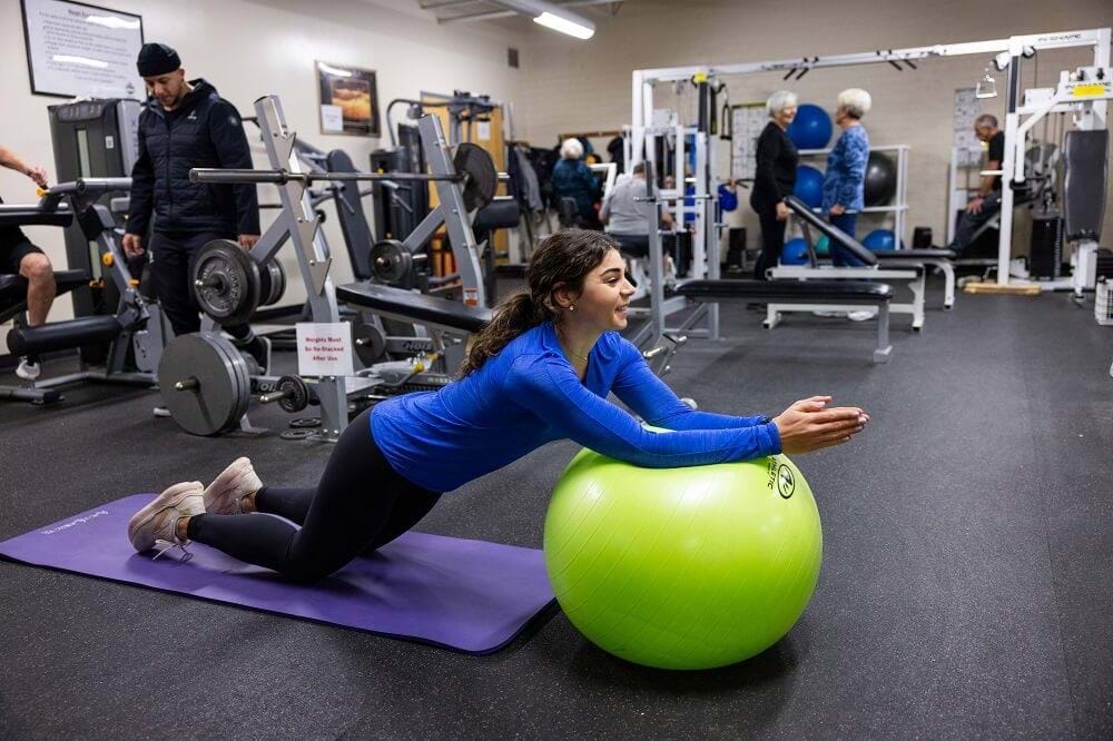 Woman exercising with exercise ball